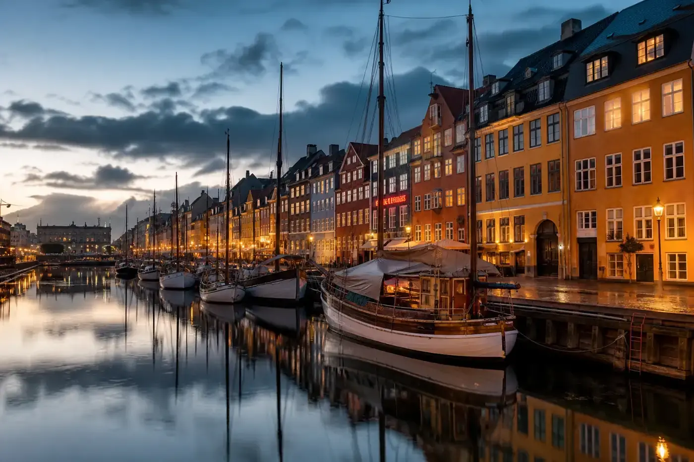 Editorial view of Copenhagen’s Nyhavn canal at dusk