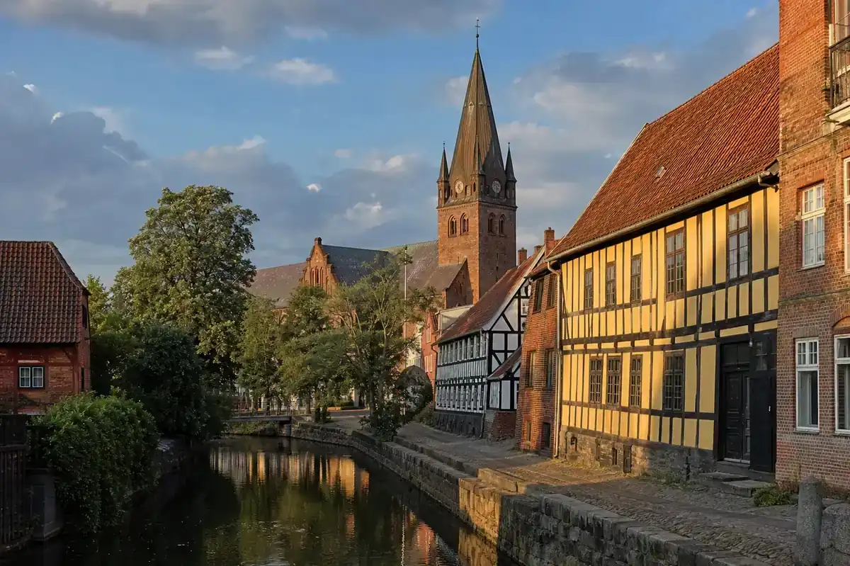 Editorial red-brick streets and river in historic Odense